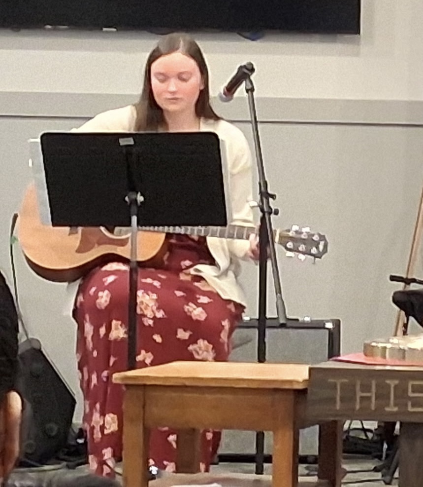 Student playing guitar